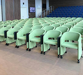 Chair with wheels and tip-up tablet for conferences, congresses and courses